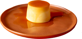 Fotografia do pudim de leite: sobremesa com calda de caramelo em prato de cerâmica.